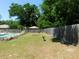 Expansive backyard with lush green lawn and privacy fence, perfect for outdoor activities at 1069 Se 57Th Ave, Ocala, FL 34480