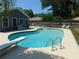 Beautiful pool with diving board surrounded by plenty of patio space at 1069 Se 57Th Ave, Ocala, FL 34480