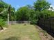 Well-maintained backyard with privacy fence, manicured lawn, and landscaping, perfect for outdoor activities and relaxation at 1069 Se 57Th Ave, Ocala, FL 34480