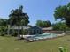 Expansive backyard features a sparkling in-ground pool and verdant landscaping at 1069 Se 57Th Ave, Ocala, FL 34480