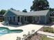 View of the backyard with an in-ground pool and lots of seating at 1069 Se 57Th Ave, Ocala, FL 34480
