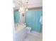 Bathroom featuring white vanity and blue shower curtain at 1069 Se 57Th Ave, Ocala, FL 34480