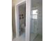 Bright bathroom featuring a glass enclosed shower, neutral tile and modern fixtures at 1069 Se 57Th Ave, Ocala, FL 34480
