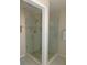 Bathroom featuring frameless glass shower with tile surround, modern fixtures, and lots of light at 1069 Se 57Th Ave, Ocala, FL 34480