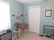 Bedroom featuring bi-fold doors, desk, and personal touches at 1069 Se 57Th Ave, Ocala, FL 34480
