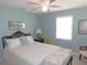 Cozy bedroom with natural light, a floral throw, and classic furniture at 1069 Se 57Th Ave, Ocala, FL 34480