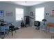 Large bedroom with windows, a guitar, amp, treadmill, and workspace at 1069 Se 57Th Ave, Ocala, FL 34480
