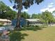 This charming home offers a well-maintained lawn and beautiful landscaping for curb appeal at 1069 Se 57Th Ave, Ocala, FL 34480