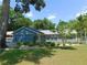 Charming single-story home with a well-maintained lawn and mature landscaping at 1069 Se 57Th Ave, Ocala, FL 34480