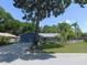 A well-manicured front lawn, and a two-car garage accentuate this lovely home at 1069 Se 57Th Ave, Ocala, FL 34480