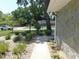 A well-maintained front yard with professional landscaping and a charming walkway at 1069 Se 57Th Ave, Ocala, FL 34480