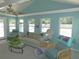 Light-filled living room features vaulted ceilings, comfortable seating, and large windows overlooking the yard at 1069 Se 57Th Ave, Ocala, FL 34480