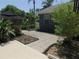 Paver patio area with beautiful landscaping, offering a serene and private backyard retreat for relaxation at 1069 Se 57Th Ave, Ocala, FL 34480