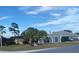 Well-maintained single-Gathering home with lush greenery and a two-car garage at 10999 Sw 47Th Ave, Ocala, FL 34476