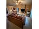 Bright and airy living room with a stone fireplace and comfortable furniture at 10999 Sw 47Th Ave, Ocala, FL 34476