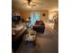 Spacious living room featuring a stone fireplace and cozy seating area at 10999 Sw 47Th Ave, Ocala, FL 34476