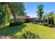 Sprawling backyard features lush green lawn and private pool and spa area at 1103 Se 46Th St, Ocala, FL 34480