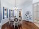 Cozy breakfast nook with bay window and hardwood floors, adjacent to the kitchen, ideal for casual dining at 1103 Se 46Th St, Ocala, FL 34480