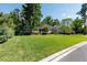 Well-manicured lawn with verdant landscaping complements home's exterior and pool at 1103 Se 46Th St, Ocala, FL 34480
