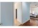 Bright hallway leads to the main bedroom with beautiful hardwood flooring and natural light at 1103 Se 46Th St, Ocala, FL 34480