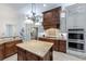 Well-equipped kitchen boasts granite counters, a center island, modern appliances, and stylish cabinetry, excellent for cooking at 1103 Se 46Th St, Ocala, FL 34480