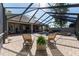 Expansive pool area features screened enclosure, spa, waterfall, and ample seating at 1103 Se 46Th St, Ocala, FL 34480