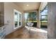Cozy screened porch with pendant chair offers private relaxation space at 1103 Se 46Th St, Ocala, FL 34480