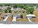 Aerial view of a well-maintained home, featuring a manicured lawn and a driveway and mature landscaping at 11118 Sw 76Th Ave, Ocala, FL 34476
