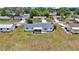 Aerial view highlighting the well-maintained yards, driveways, and mature trees within a quiet neighborhood at 11118 Sw 76Th Ave, Ocala, FL 34476