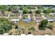 Community aerial view showcasing well-maintained lawns, driveways, and mature trees in a residential neighborhood at 11118 Sw 76Th Ave, Ocala, FL 34476