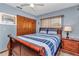 This cozy bedroom includes nautical decor, wood furniture, and natural light at 11118 Sw 76Th Ave, Ocala, FL 34476