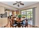 Bright dining area features wood floors and sliding glass doors leading to the lanai at 11118 Sw 76Th Ave, Ocala, FL 34476