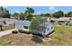 Well-maintained single-story home featuring a tidy front yard, driveway, and an attached two-car garage at 11118 Sw 76Th Ave, Ocala, FL 34476