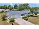 Charming single-story home with a well-manicured lawn, landscaped garden, and a two-car garage at 11118 Sw 76Th Ave, Ocala, FL 34476