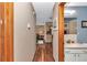 Hardwood flooring in hallway leading to bathroom and living spaces at 11118 Sw 76Th Ave, Ocala, FL 34476