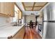 Open kitchen with stainless steel appliances adjacent to dining area at 11118 Sw 76Th Ave, Ocala, FL 34476