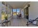 Bright sunroom with tiled floors and sliding glass doors at 11118 Sw 76Th Ave, Ocala, FL 34476