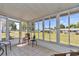 Relaxing sunroom with tile floors, views of the lush backyard, and comfortable seating; great relaxation space at 11118 Sw 76Th Ave, Ocala, FL 34476