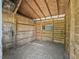 Interior view of barn with wooden walls and plywood ceiling at 13897 W Highway 328, Ocala, FL 34482