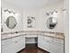 Dual sink bathroom featuring white cabinets, updated fixtures and countertops at 13897 W Highway 328, Ocala, FL 34482