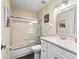 Bathroom featuring tiled shower, new vanity with updated fixtures and countertops at 13897 W Highway 328, Ocala, FL 34482