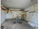 Spacious garage with concrete floor, shelves, workbench, and equipment at 13897 W Highway 328, Ocala, FL 34482