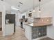 Modern kitchen featuring white cabinets, stainless steel appliances, and stylish backsplash at 13897 W Highway 328, Ocala, FL 34482