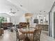 Bright and airy living space with vaulted ceilings, combining the living room, dining area, and kitchen at 13897 W Highway 328, Ocala, FL 34482
