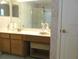 Bathroom featuring a light-colored vanity and framed mirror at 14244 Sw 115Th Cir, Dunnellon, FL 34432