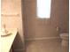 Bright bathroom featuring light patterned wallpaper and a clean vanity at 14244 Sw 115Th Cir, Dunnellon, FL 34432