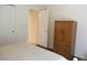 Bedroom featuring a bed, closet, doorway, and dresser, providing ample storage and comfort at 14244 Sw 115Th Cir, Dunnellon, FL 34432