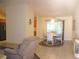 Bright dining area with a window view, seamlessly connected to the living room and kitchen at 14244 Sw 115Th Cir, Dunnellon, FL 34432