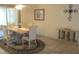 Bright formal dining area boasts tile floors, ceiling fan and neutral wall art at 14244 Sw 115Th Cir, Dunnellon, FL 34432