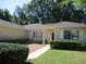 Charming single-story home with well-manicured front lawn and walkway at 14244 Sw 115Th Cir, Dunnellon, FL 34432